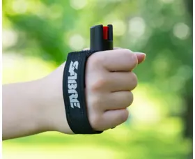 Obranný gel SABRE RED Runner pro běžce, s nastavitelným páskem na ruku, černý